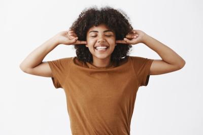 Joyful African American Woman in Trendy Brown T-Shirt Enjoying Silence – Free Stock Photo, Download for Free