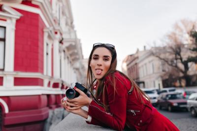 Gorgeous European Lady Posing with Tongue Out While Exploring the City with a Camera – Free Stock Photo, Download Free Stock Photo