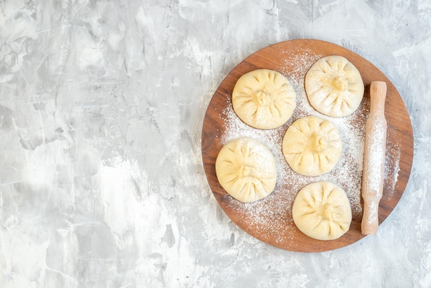 Little Raw Dumplings on a White Background – Free Stock Photo for Download