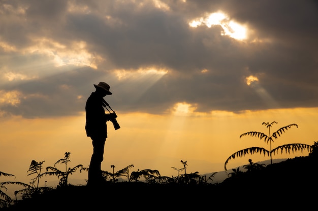 Photographer Capturing a Sunset in the Mountains – Free Stock Photo, Download Free