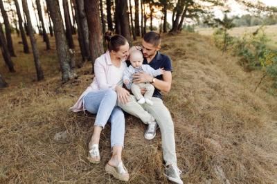 Portrait of a Young Family in a Beautiful Autumn Pine Forest – Free Stock Photo for Download