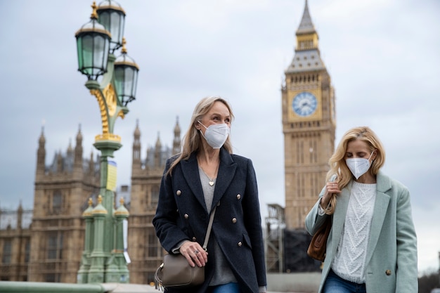 Tourists Exploring the City in Travel Masks – Free Download