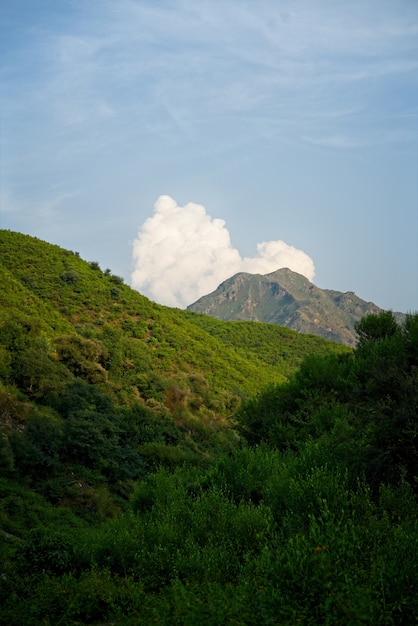 Scenic Mountain Landscape with Clouds and Blue Sky – Free Download