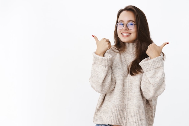 Pleased Female Customer in Sweater and Glasses Giving Thumbs Up – Free Download