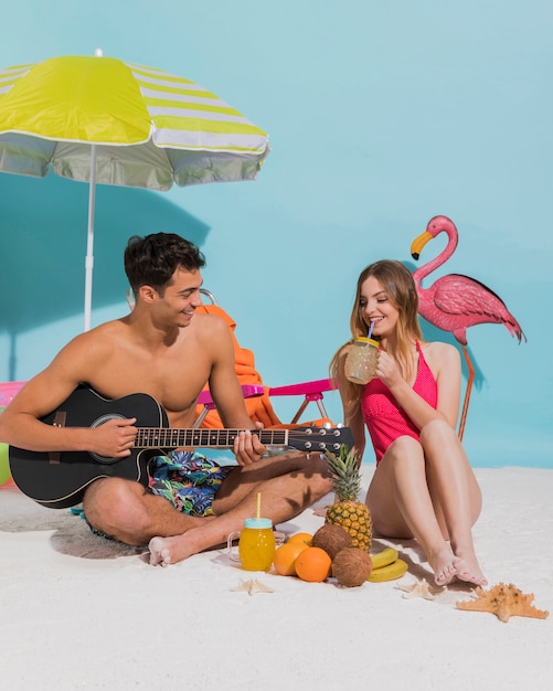 Young Couple Relaxing on Sand â Free Stock Photo for Download