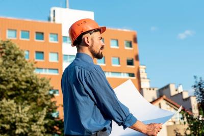 Side View of Architect Holding Plans – Free Stock Photo, Download for Free