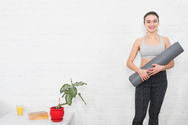 Fitness Girl Posing with Yoga Mat – Free Stock Photo for Download