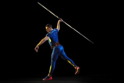 Male Athlete Practicing Javelin Throwing in Neon Light – Free Stock Photo, Download for Free