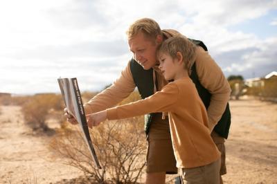 Kid and Man Reading Sign – Free Stock Photo for Download