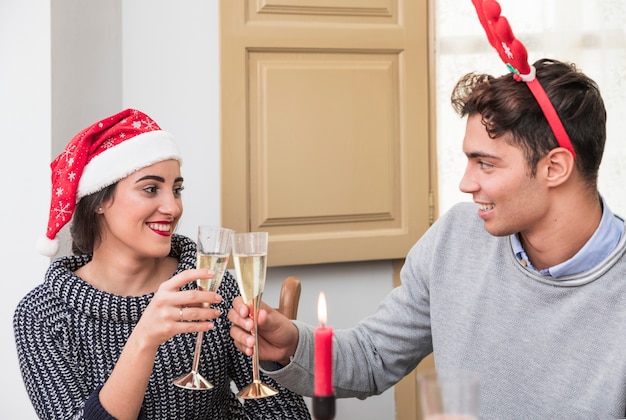 Festive Celebration: Couple Clanging Champagne Glasses – Free Stock Photo, Download Free