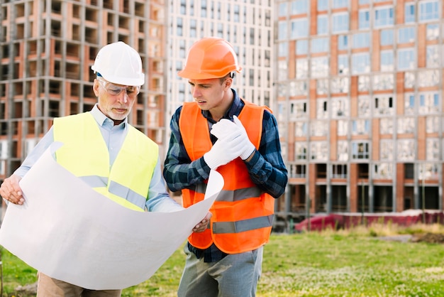 Medium Shot of People Wearing Protection Equipment and Gloves – Free Download