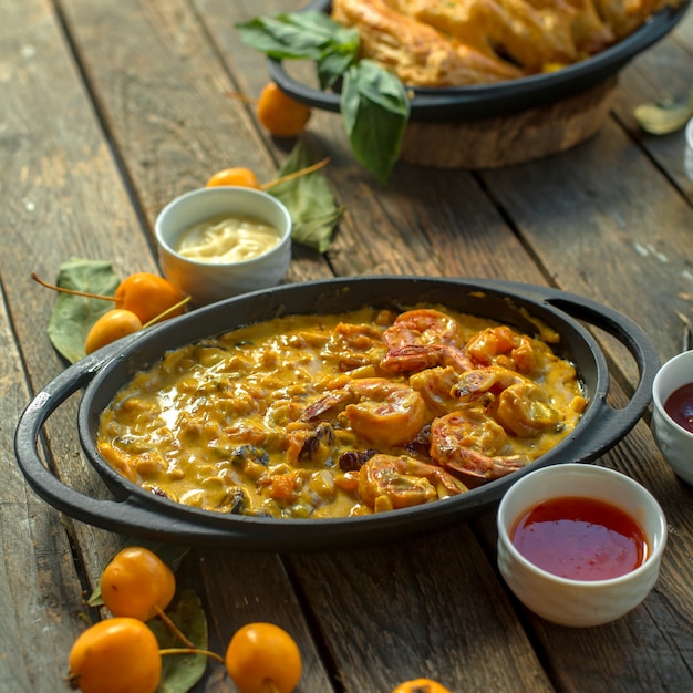 Delicious Side View of Fried Eggs with Shrimps and Vegetables in a Pan – Free Download