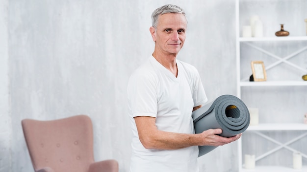 Smiling Old Man at Home with Yoga Mat – Free Stock Photo for Download