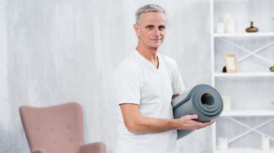 Smiling Old Man at Home with Yoga Mat – Free Stock Photo for Download