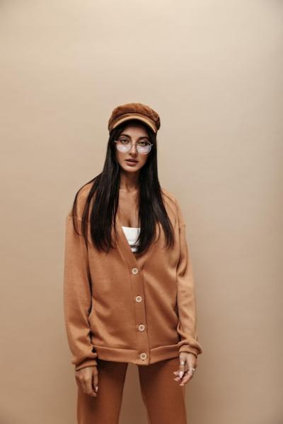 Calm Serious Woman in Light Brown Cashmere Suit and Cap – Free Stock Photo Download