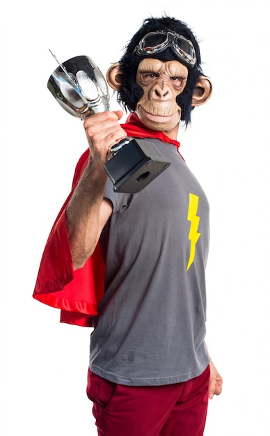 Superhero Monkey Man Holding a Trophy – Free to Download