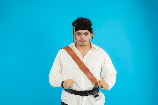 Young Angry Pirate Portrait on Blue Background – Free Stock Photo for Download