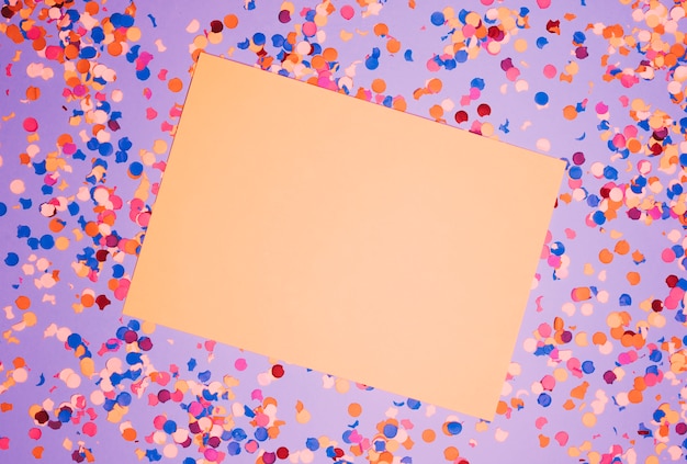 Blank Paper Over Colorful Confetti Against Purple Backdrop – Free Stock Photo, Download for Free