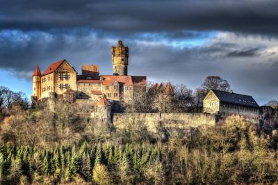 Beautiful Historical Castle Against a Dramatic Cloudy Sky – Free Download