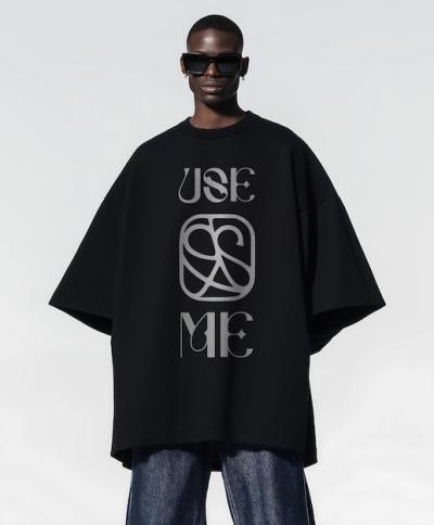 A Man Wearing a Black Cape with the Word “Me” on It – Free Download