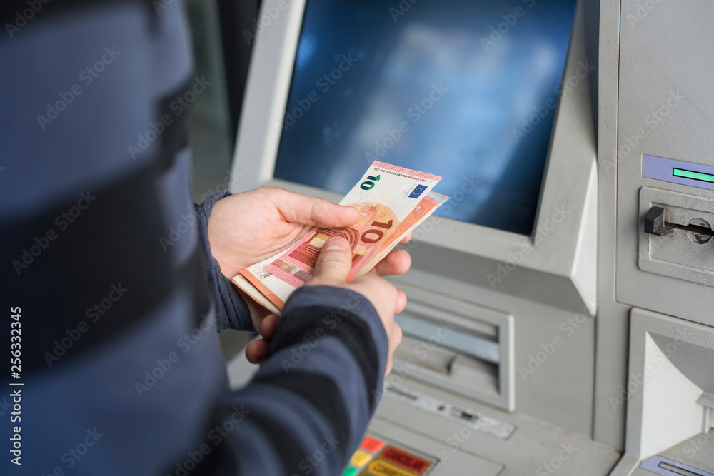 withdrawing money StockFoto Adobe Stock