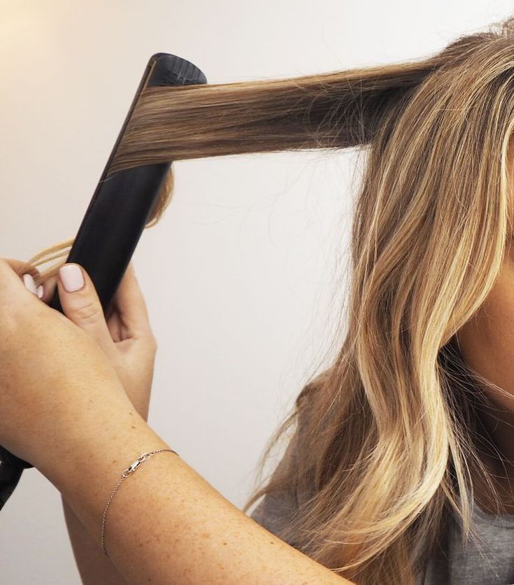 How to Curl Your Hair with a Flat Iron According to Stylists Curl